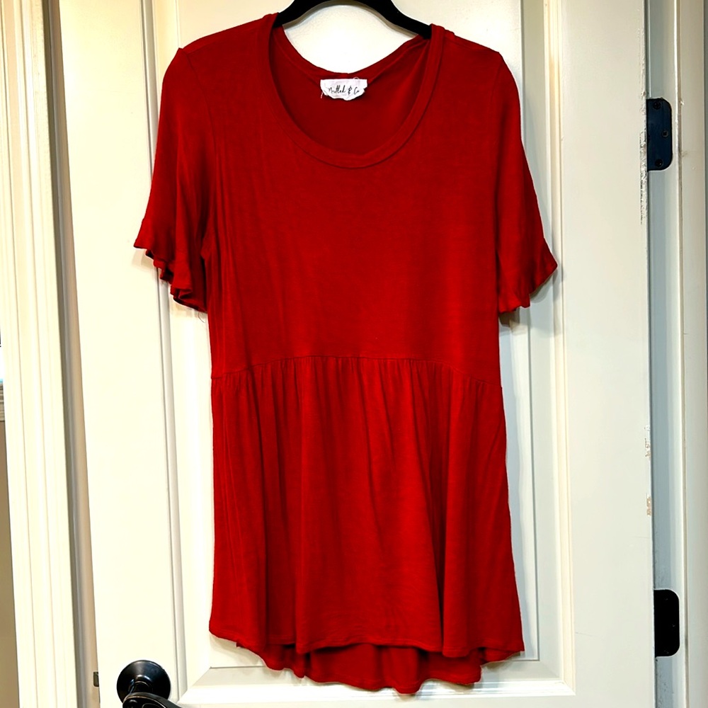 Top from Nestled & Co Boutique. Size large - rust color